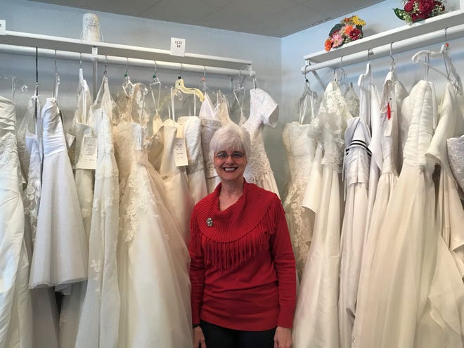 Owner Jill Nezworski prepares to close With This Ring bridal shop after a decade in business. Her favorite part of the job has been making friends with strangers and putting people at ease while they shop for their big days.