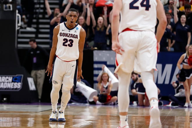 Gonzaga guard Zach Norvell Jr. (23) reacts after a 3-pointer by Gonzaga forward Corey Kispert (24) against Fairleigh Dickinson in the first half during a first round men's college basketball game in the NCAA Tournament Thursday, March 21, 2019, in Salt Lake City. (AP Photo/Jeff Swinger) ORG XMIT: OTKUTJS200