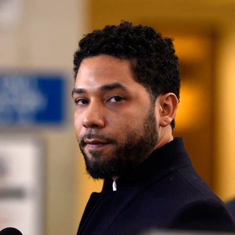 Actor Jussie Smollett talks to the media before...
