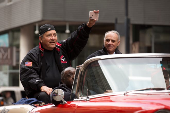 Cincinnati Reds Hall of Fame Johnny Bench rides with MLB Commissioner Rob Manfred during the 100th Findlay Market Opening Day Parade in downtown Cincinnati.