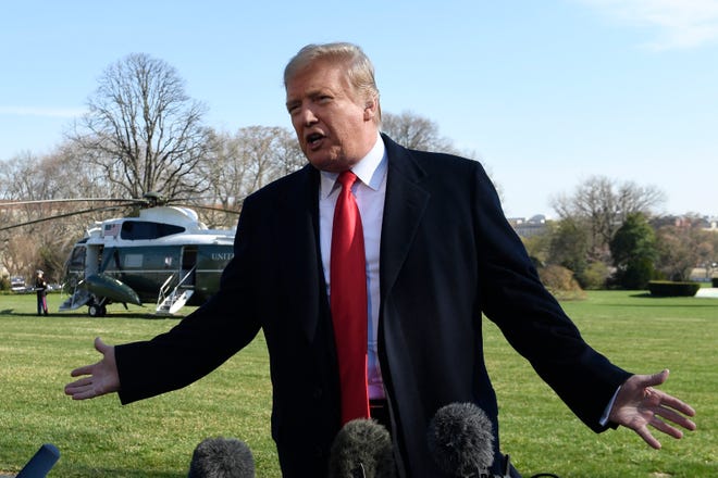 President Donald Trump talks with reporters before boarding Marine One on the South Lawn of the White House in Washington, Thursday, March 28, 2019, for the short trip to Andrews Air Force Base in Maryland. Trump is traveling to Michigan to speak at a rally before spending the weekend at his Mar-a-Lago estate in Florida.