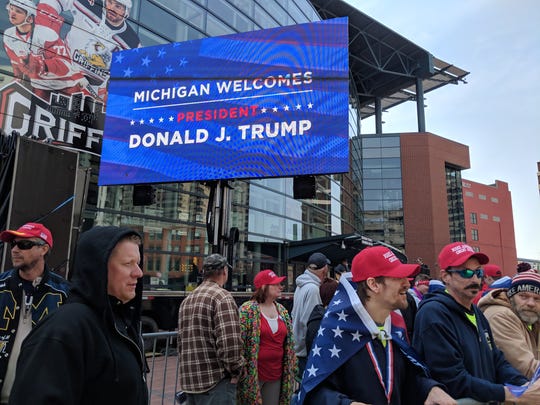 Trump supporters line up outside the Van Andel Arena in downtown Detroit.