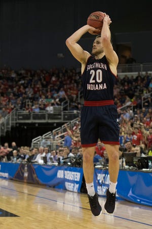 University of Southern Indiana's Alex Stein (20) takes a three-point shot during the University of Southern Indiana Screaming Eagles vs West Texas A&M Buffaloes game of the NCAA Men's Division II Elite 8 Basketball Tournament at the Ford Center in Evansville, Ind. Wednesday, March 27, 2019.  