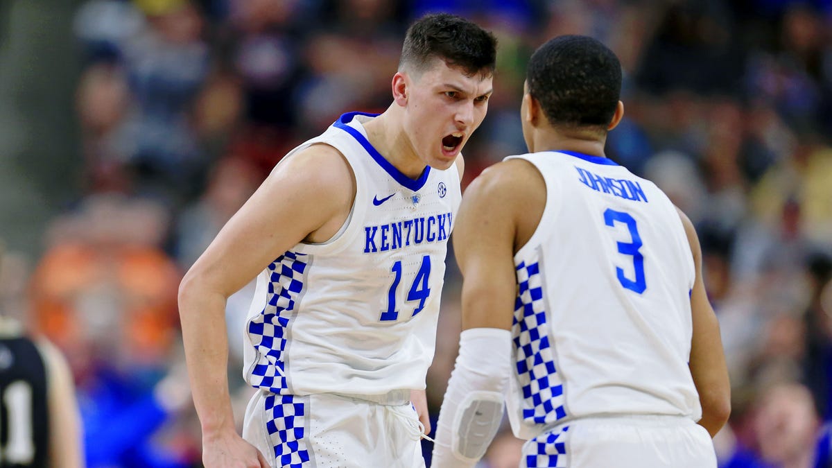 Kentucky guards Tyler Herro (14) and Keldon Johnson (3) celebrate after a play against Wofford in the second round.