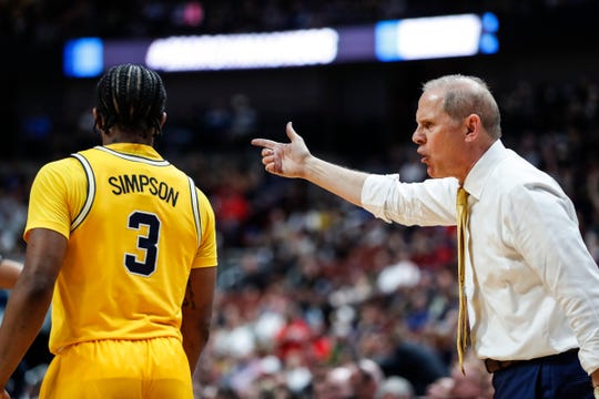 Michigan coach John Beilein talks to guard Zavier Simpson (3) during the second half of the 63-44 loss in the Sweet 16 against Texas Tech in Anaheim, Calif., Thursday, March 28, 2019.