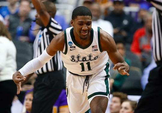 Michigan State forward Aaron Henry gestures after making a 3-pointer against LSU during the first half of an East Regional semifinal in the NCAA tournament in Washington, Friday, March 29, 2019.