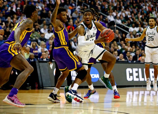 Michigan State forward Aaron Henry drives to the basket against LSU guard Marlon Taylor during the first half of an East Region semifinal in the NCAA tournament on Friday, March 29, 2019, in Washington.