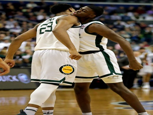 Michigan State forward Xavier Tillman and forward Gabe Brown celebrate during the first half of an East Region semifinal in the NCAA tournament on Friday, March 29, 2019, in Washington.