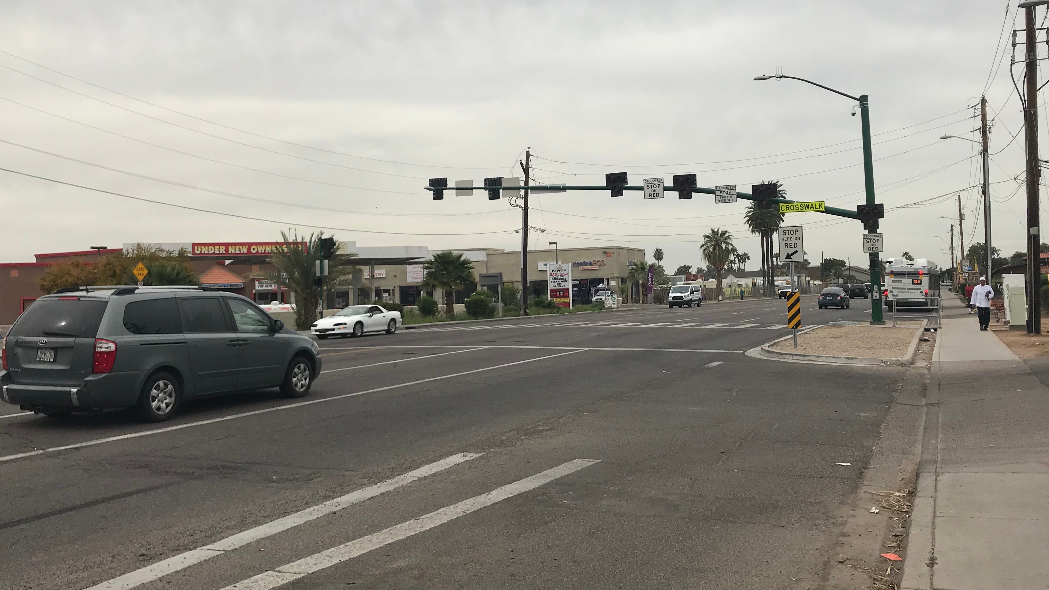 On 35th Avenue in Phoenix, a HAWK crossing signal hangs above a crosswalk.