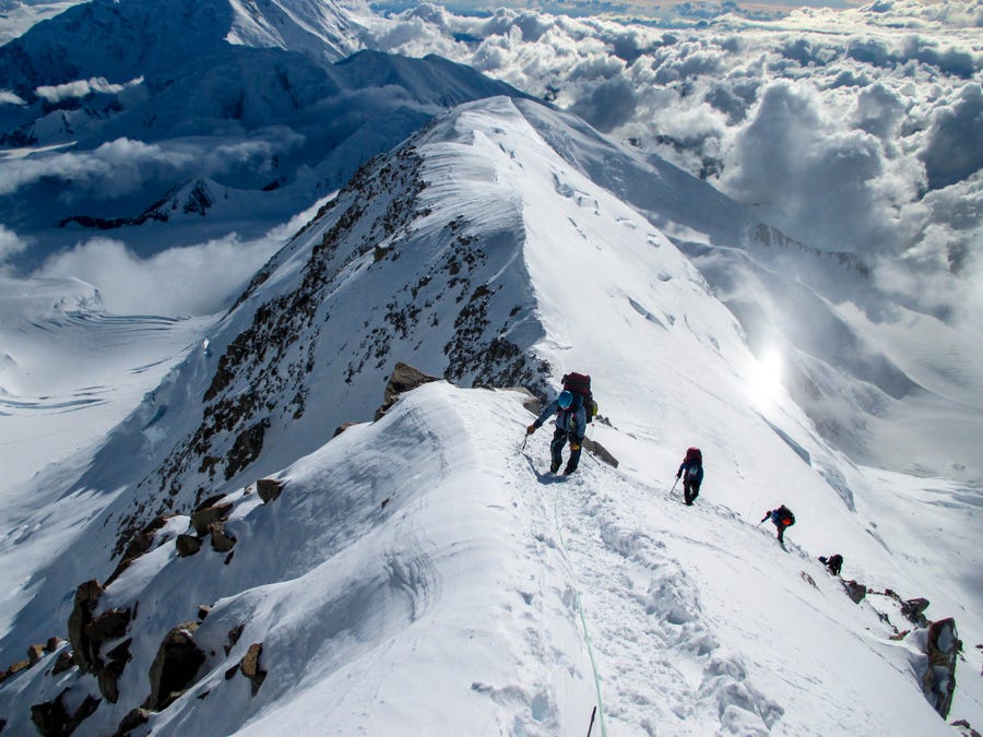 A group led by RMI Expeditions guides climbs Denali, the tallest peak in North America, in Alaska.