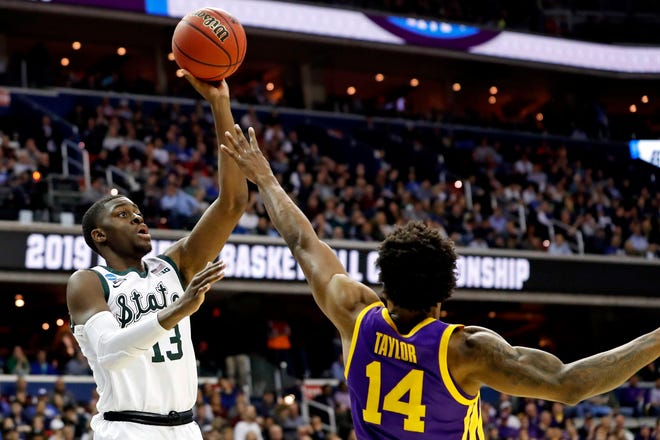 Mar 29, 2019; Washington, DC, USA; Michigan State Spartans forward Gabe Brown (13) shoots the ball against LSU Tigers guard Marlon Taylor (14) during the second half in the semifinals of the east regional of the 2019 NCAA Tournament at Capital One Arena. Mandatory Credit: Geoff Burke-USA TODAY Sports