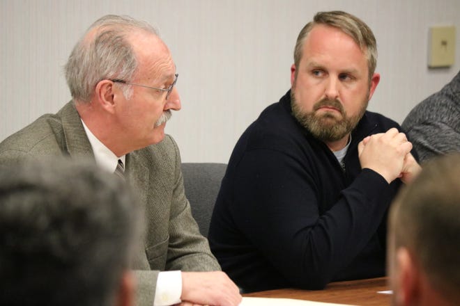 Port Clinton Law Director George Wilber and Councilman Gabe Below discuss the procedure for the selection of a new mayor to finish the remaining term left by Hugh Wheeler, who resigned Thursday, at special meeting of Port Clinton City Council on Friday.