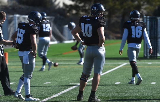 Nevada sophomore Griffin Dahn (10) and the other Wolf Pack quarterbacks participate in a spring practice session in Reno on March 30.