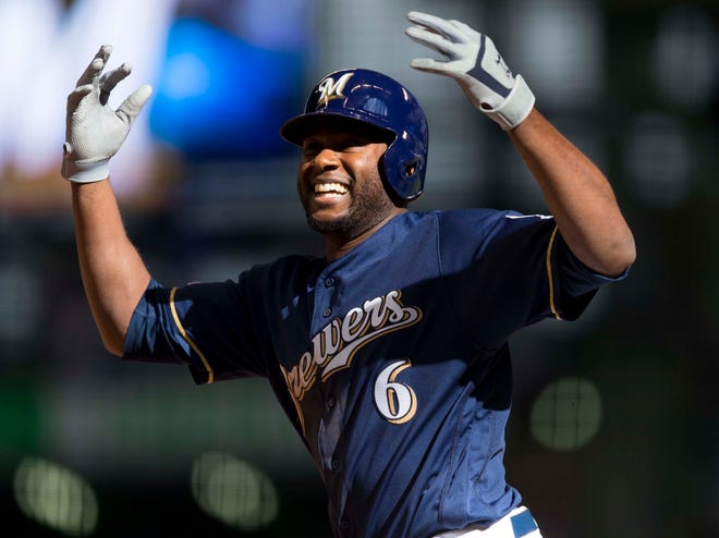 Mar 31, 2019; Milwaukee, WI, USA; Milwaukee Brewers center fielder Lorenzo Cain (6) celebrates after reaching base during the ninth inning against the St. Louis Cardinals at Miller Park. Mandatory Credit: Jeff Hanisch-USA TODAY Sports