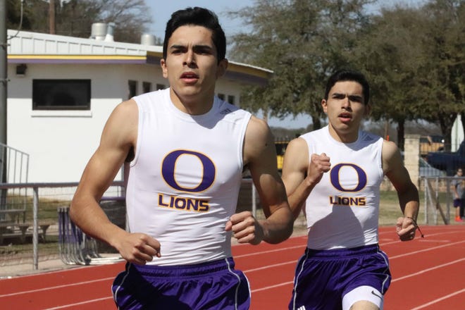 Ozona twin brothers Manuel and Humberto Torralba in action at the Ozona Relays earlier this season.