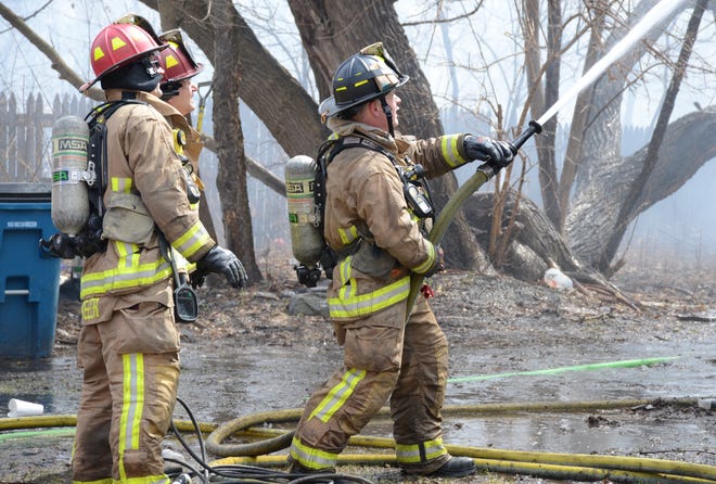 Firefighters battle a blaze Sunday at 513 Hamblin Ave.