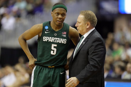 Cassius Winston talks with coach Tom Izzo during MSU's 68-67 win in the NCAA tournament East Region final Sunday.