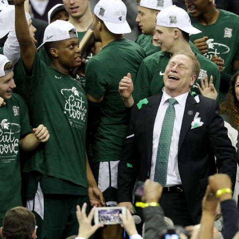 Tom Izzo and wife Lupe, right, celebrate Michigan 