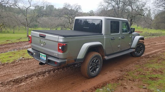 The 2020 Jeep Gladiator pickup in Overland trim. The pickup borrows the Wrangler's chassis - but is all-new from the b-pillar rear-ward.