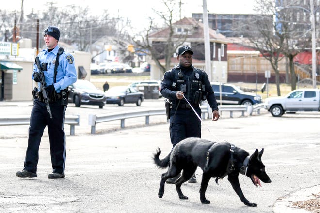 Lansing Police and a tracking dog were in the area north of West Saginaw Street near Chicago Avenue after a reported shooting incident  on Monday, April 1, 2019, in Lansing.