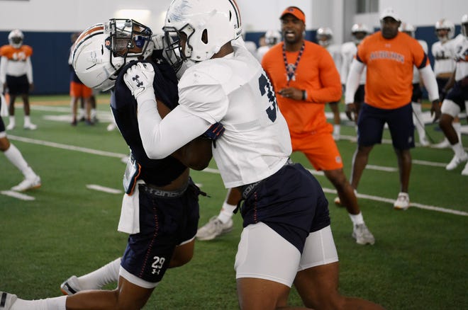 Chandler Wooten (right) and Harold Joiner (left) during practice on Monday, March 25, 2019 in Auburn, Ala.