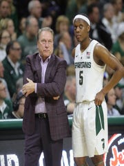 Michigan State Head Coach Tom Izzo talks with Cassius Winston in the second half of the match against Green Bay on Sunday, December 16, 2018 in East Lansing.