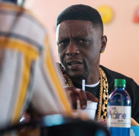 Rapper Boosie eats lunch while being interviewed a