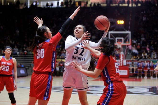 Piedra Vista's Lanae Billy puts up a contested shot against West Mesa's Jazmin Cordova (30) and Esperanza Varoz (15) during the 5A state semifinals on Thursday, March 14 at Dreamstyle Arena in Albuquerque. Billy made the 5A All-State first team.