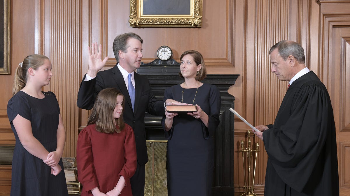 Chief Justice John Roberts administered the constitutional oath to Associate Justice Brett Kavanaugh in the Justices' Conference Room of the Supreme Court in October, with Kavanaugh's wife and daughters looking on.