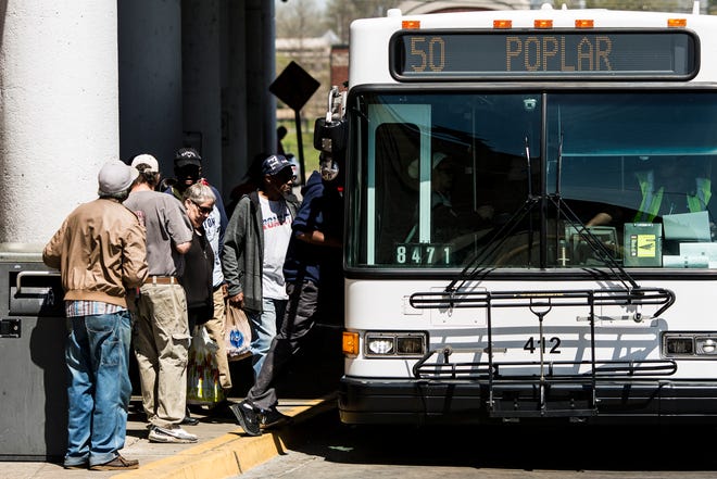 Riders board a MATA bus at the William Hudson Transit Center in downtown Memphis on April 3, 2019.