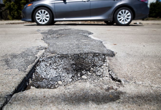 Potholes mar East 26th Street near Southside Middle School in this file photo.