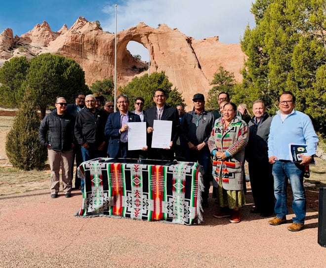 At center, Navajo Nation President Jonathan Nez and Vice President Myron Lizer were joined by tribal officials, division directors and small business owners at the proclamation signing on Tuesday in Window Rock, Ariz.