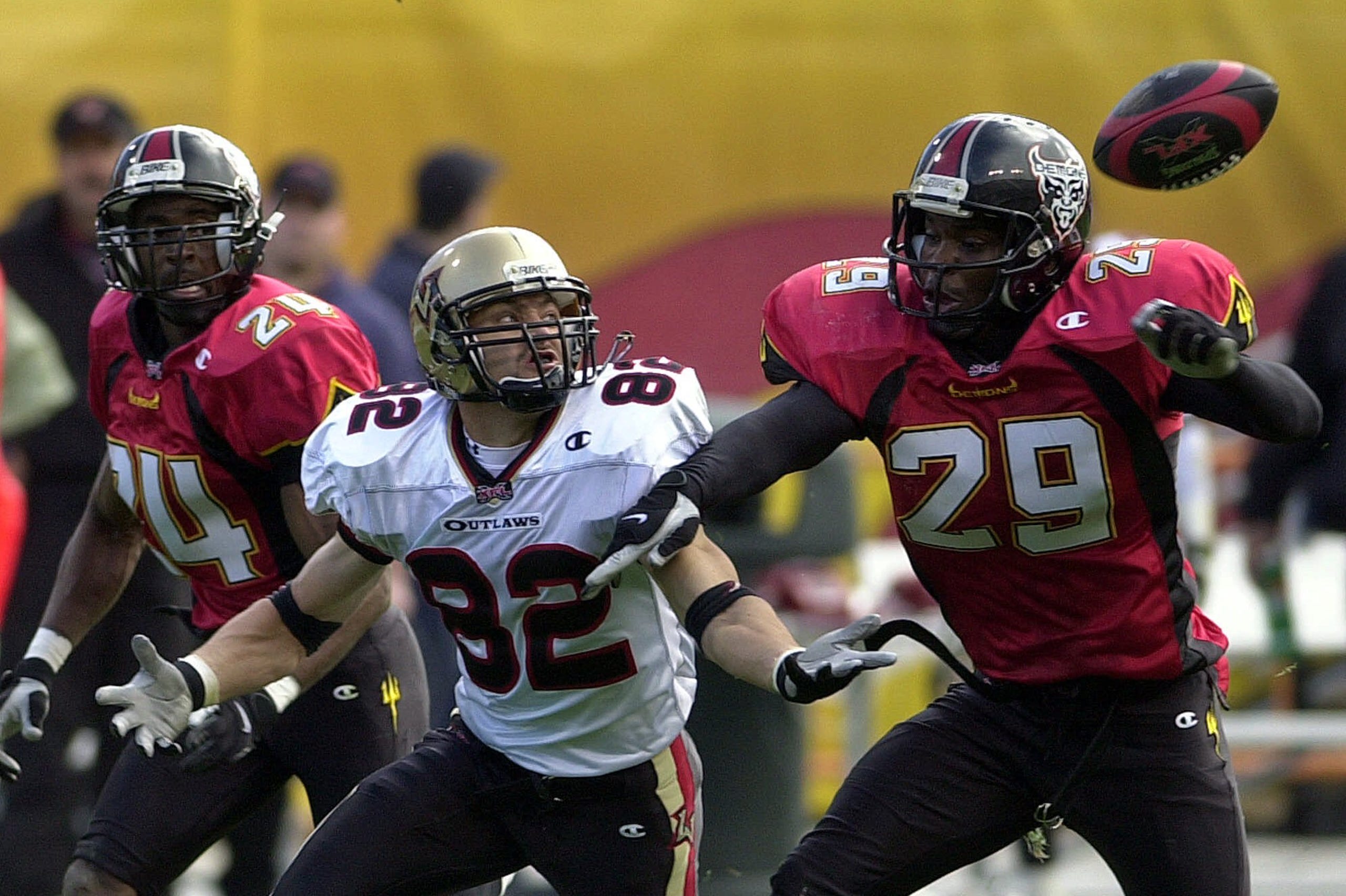 The San Francisco Demons' Terrance Joseph (29) breaks up a pass intended for Las Vegas Outlaws wide receiver Mike Furrey (82) in an XFL game in 2001.
