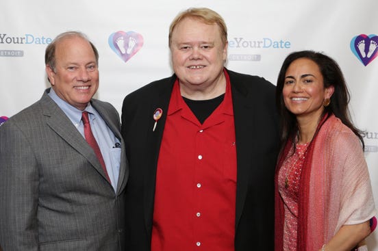 Detroit Mayor Mike Duggan poses with headlining comedian Louie Anderson and Dr. Sonia Hassan, the president and director of Make Your Date, at the 2015 fundraiser gala at the MGM Grand Detroit.