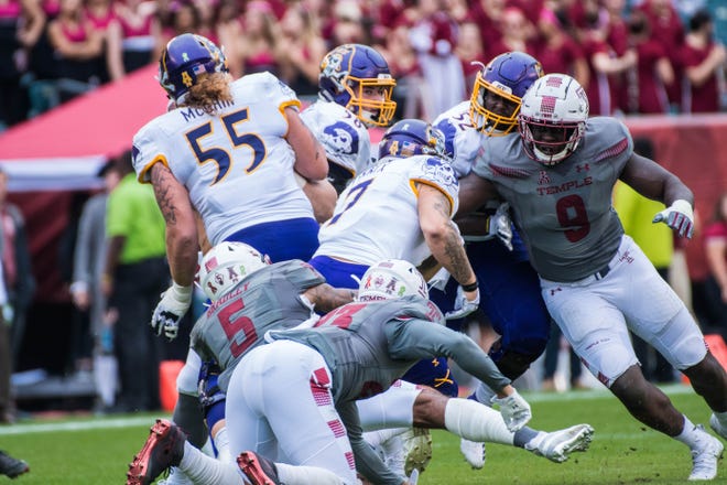 Michael Dogbe of Morris Plains (right, No. 9) finished his Temple University career with 77 solo tackles (19.5 for loss), 8.5 sacks and five forced fumbles in 54 games.
