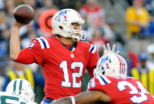 Tom Brady wears the classic Patriots' regressive uniform during a game against the Jets in 2012 at Gillette Stadium.