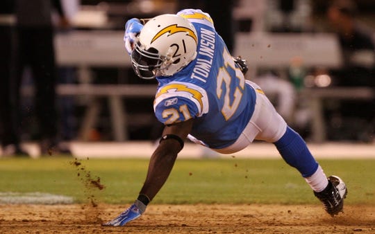 LaDainian Tomlinson presented the Chargers' powder blue classic in a 2009 Raiders game.