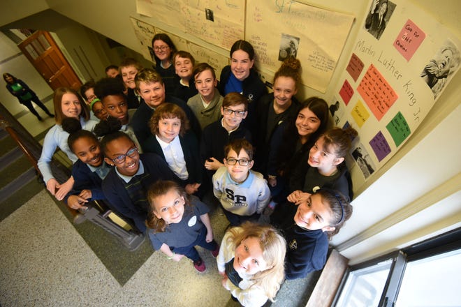 Fifth and sixth graders from St. Peter's Elementary School recently created posters illustrating civil rights leaders who have lived one or more of the seven Catholic Social Principles.