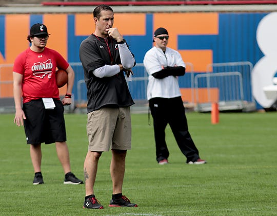 UC head football coach Luke Fickell watches his team during practice at Nippert Stadium in Cincinnati Saturday, April 6, 2019.