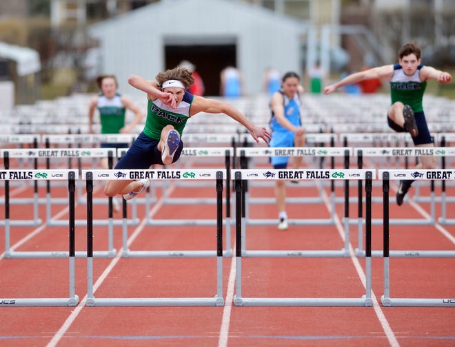 Glacier's Drew Deck runs in the 100m Hurdles during Friday's track meet against Great Falls High at Memorial Stadium.