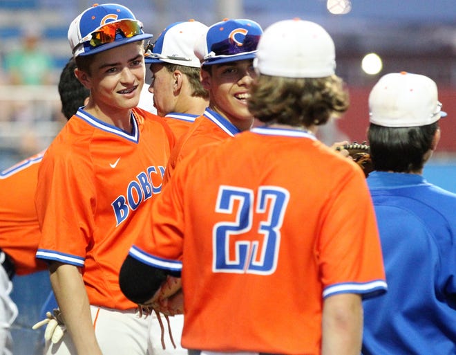 The San Angelo Central Bobcats share a laugh during a game earlier in the 2019 baseball season.