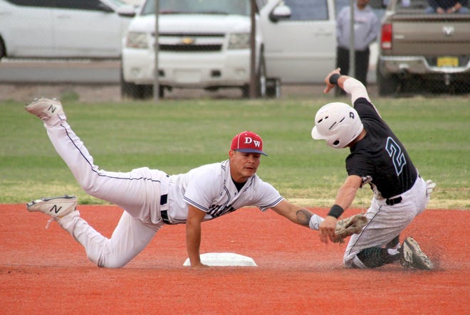 Junior Wildcat short stop Fernie Munoz lunges to apply a tag on Onate base runner Dylan Snyder during Friday's District 3-5A double-header. The Knights took two from the Wildcats, 7-2 and 3-1 at E.J. Hooten Park.