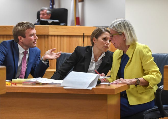 Martin County Commissioner Sarah Heard (right) talks with her attorneys (from left) Jordan Wagner and Barbara Kibbey Wagner, as they prepare for jury selection for Commissioner Heard's misdemeanor trial at the Martin County Courthouse on Monday, April 8, 2019, in Stuart. Commissioner Heard is charged with two first-degree misdemeanor offenses of violating public records laws. The trial under Senior Judge James David Langford is expected to last through the week.