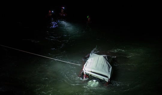 A Toyota FJ cruiser in the ocean off Pacific Coast Highway, south of Mugu Rock, Sunday night. The driver was killed.