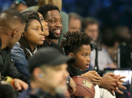 Dwayne Wade, Gabrielle Union-Wade and her family attend the 3-point MTN DEW contest at the 2019 NBA All-Star Weekend at the Spectrum Center on February 16, 2019 in Charlotte, North Carolina.
