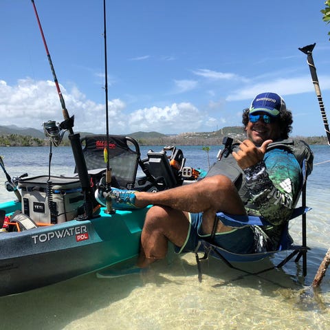 Capt. Jose Aponte enjoys a break in the fishing...
