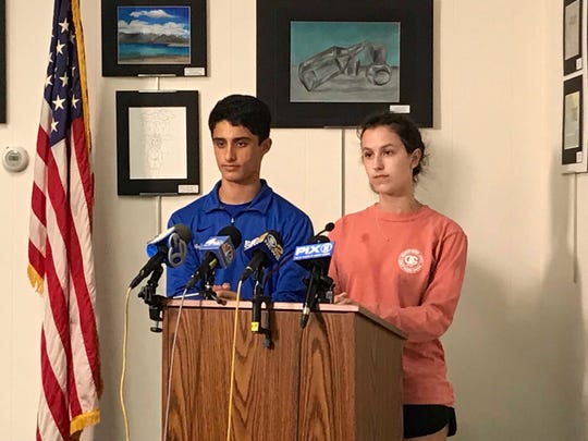 Westfield High School seniors Adam Holtzman and Avery Conrad, who both work on the weekly student newspaper Hi's Eye address media during a news conference about the late Principal Derrick Nelson.