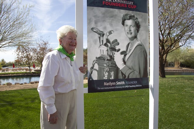 Marilynn Smith poses with a photo of herself from her younger days. Smith was one of the 13 founders of the LPGA.