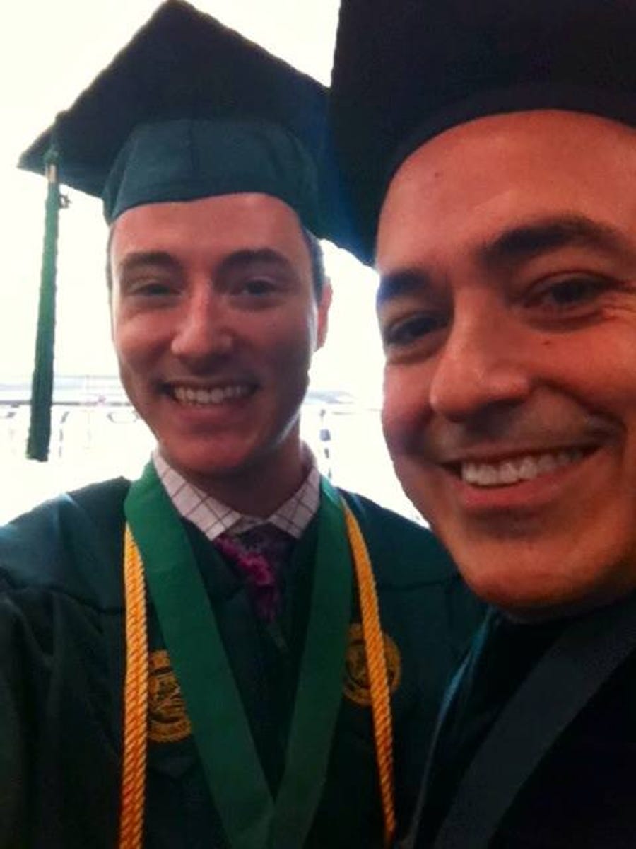 Zach Eisenstein and George Mason University President Ángel Cabrera