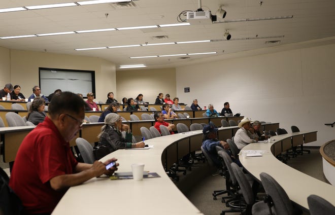 Attendees learn about the Land Buy-Back Program under the U.S. Department of the Interior during an information session on Tuesday at San Juan College in Farmington.